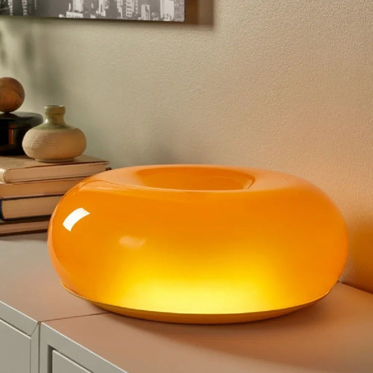 Sculptural Glass Donut Table Lamp amber - hand-finished glass torus with warm glow - Neovall
