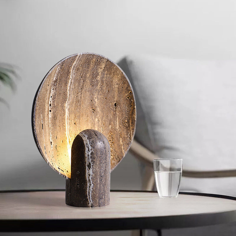 Wabi-Sabi Travertine Disc Table Lamp front view - raw natural stone backlit like a full moon - Neovall