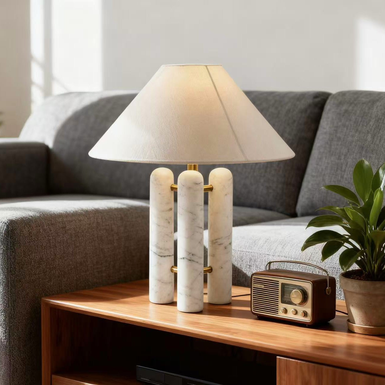 Marble column table lamp in modern living room setting - warm ambient glow
