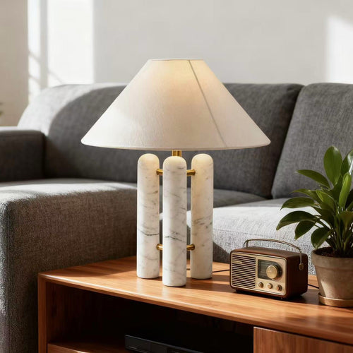 Marble column table lamp in modern living room setting - warm ambient glow