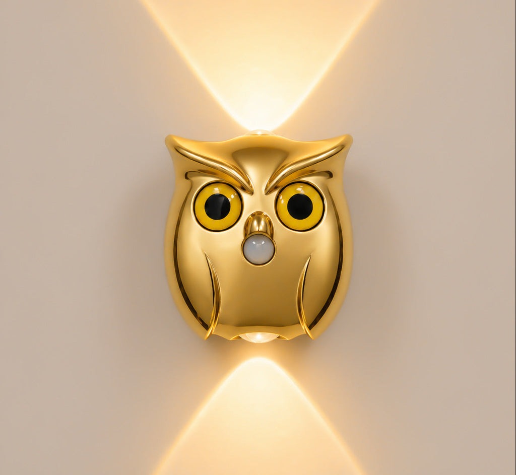 Gold owl wall light with motion sensor and warm ambient lighting