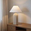 Art Deco Arch Resin Table Lamp lifestyle shot - sculptural arched base with linen shade - Neovall